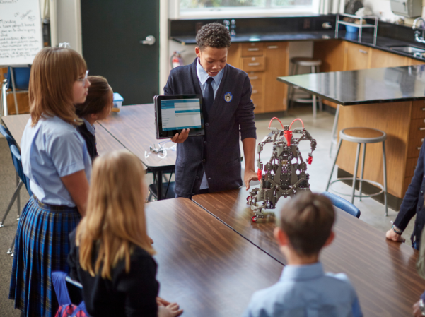 Students interacting with robot